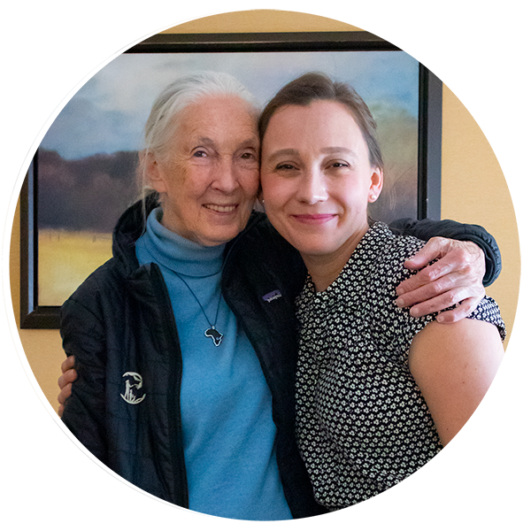 Meagan Thibeault and Dr. Jane Goodall embracing one another and smiling for a photo.
